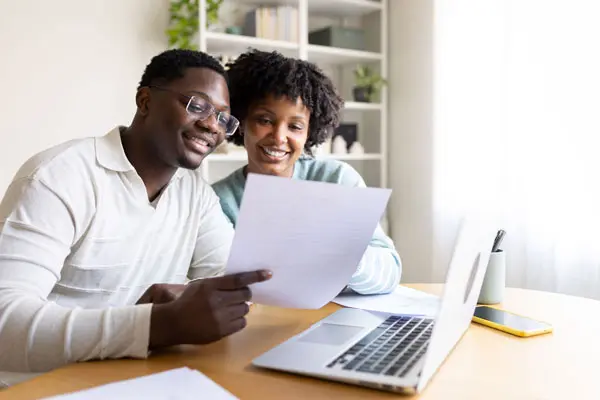 Couple reviewing refinance documents together