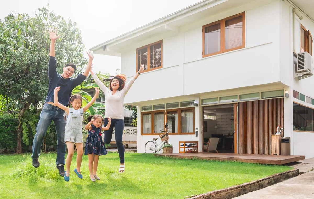Family celebrating in the backyard of their home