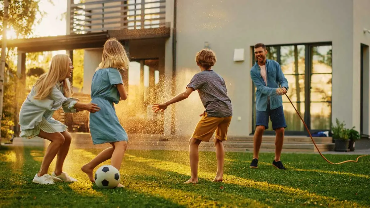 Family playing together in the backyard