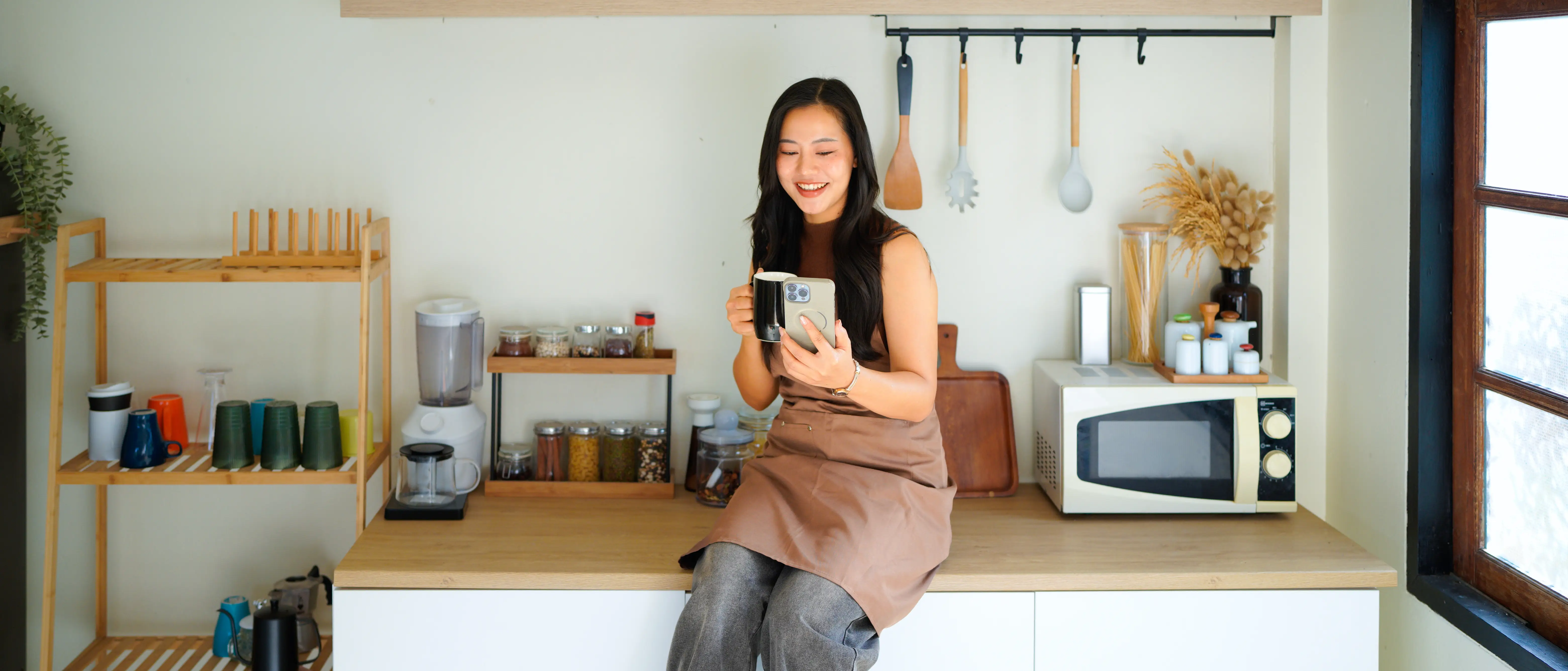 Homeowner smiling in a bright kitchen