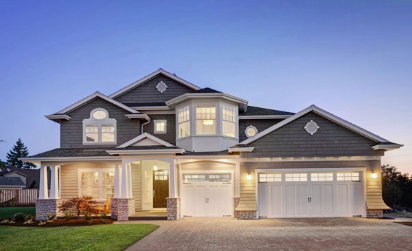 Craftsman-style home lit at dusk