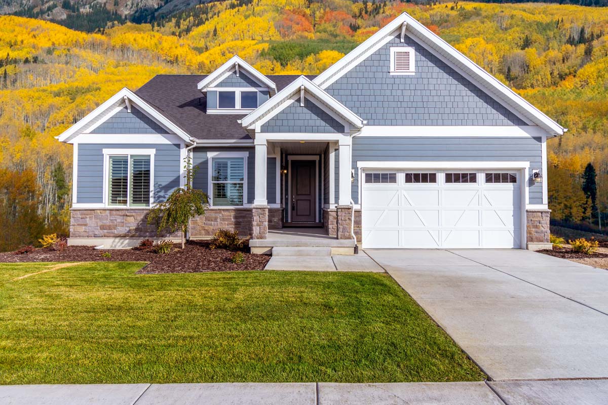 Grey home with a stone-accented facade