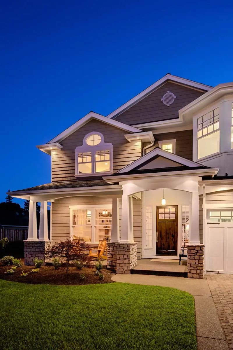 Home glowing warmly at dusk