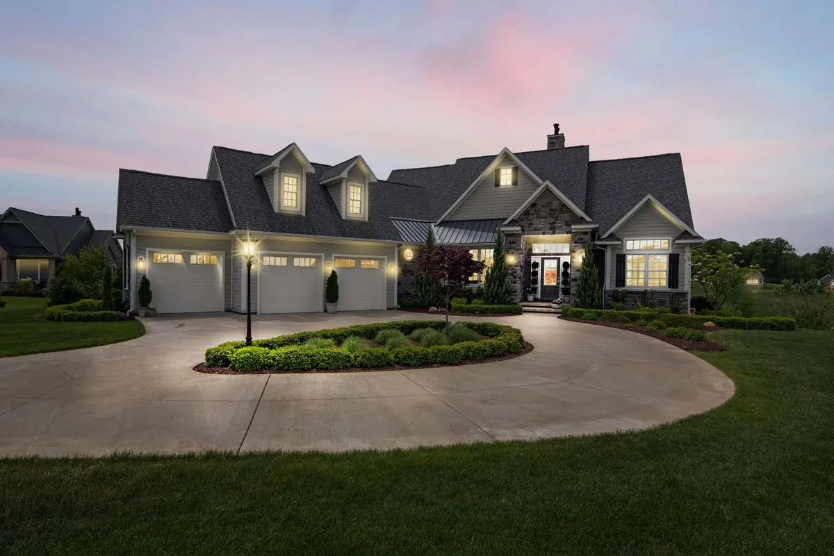 Suburban home lit warmly in the evening