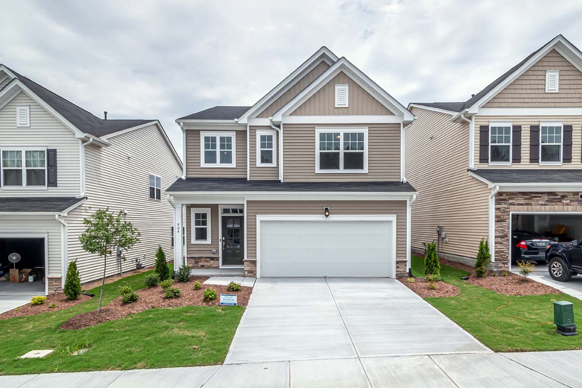Compact tan home suited to a first purchase