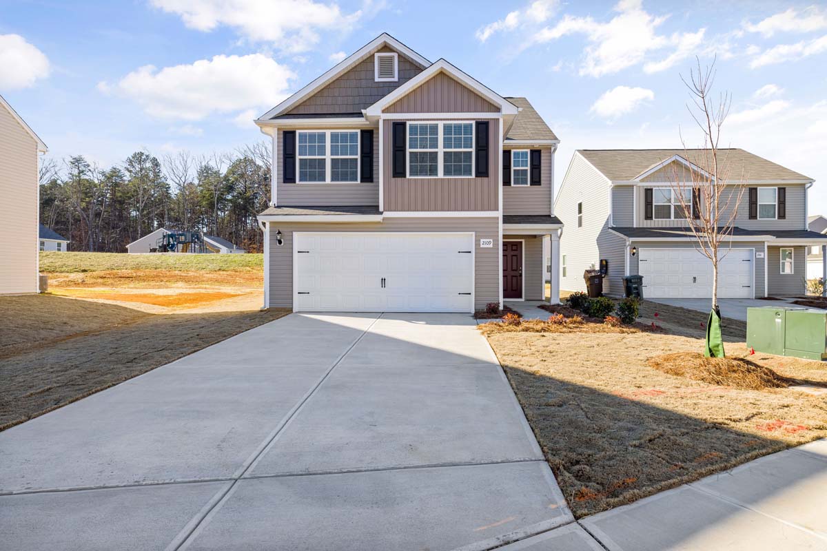 Light brown suburban home with a steady, classic look